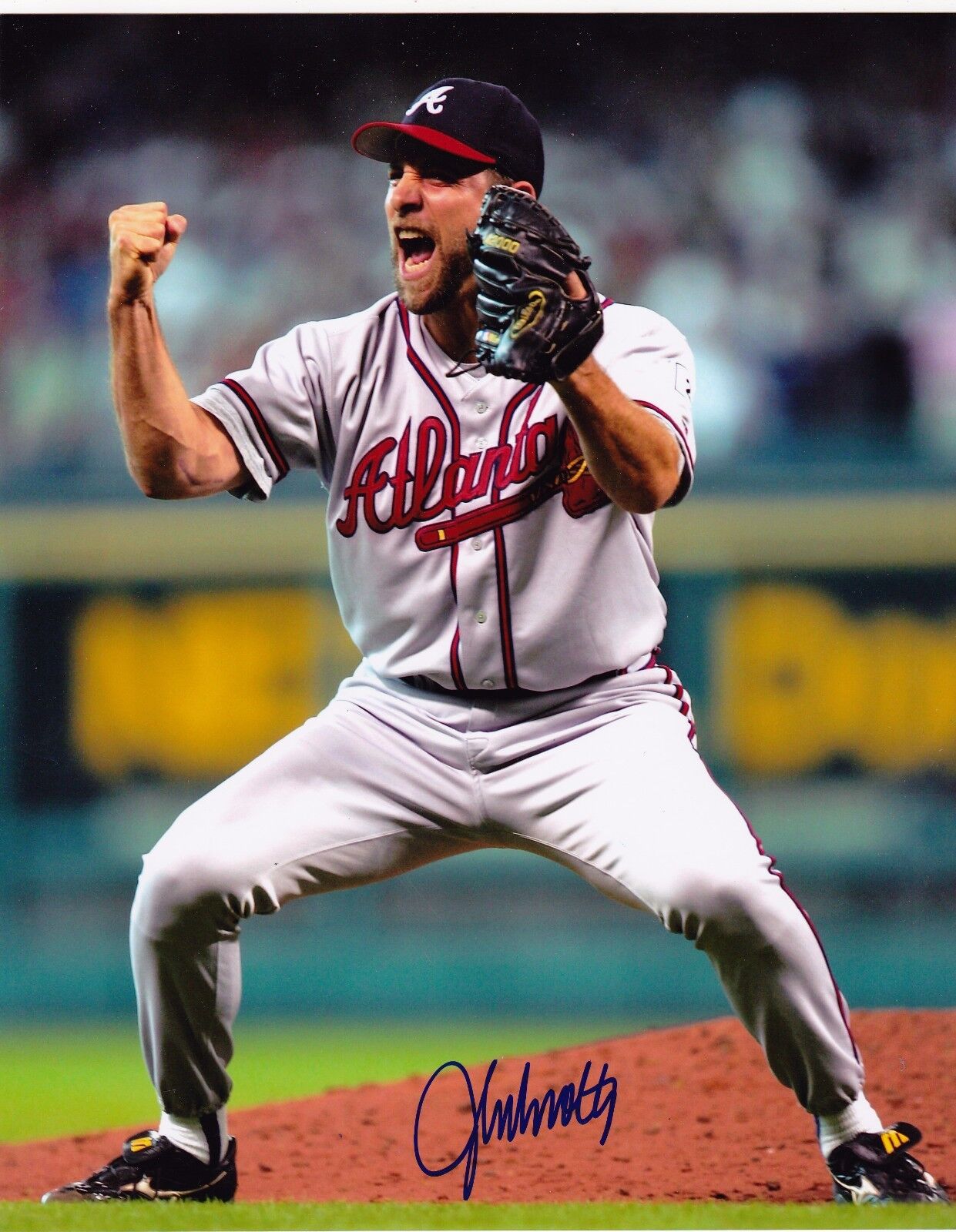 JOHN SMOLTZ ATLANTA BRAVES ACTION SIGNED 8x10