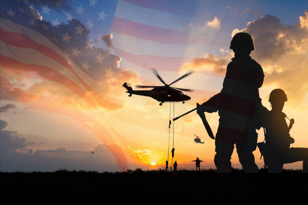 Double exposure Silhouette of Soldier on the United States flag in sunset for Veterans Day is an official USA public holiday background,copy space. Double exposure Silhouette of Soldier on the United States flag in sunset for Veterans Day is an official USA public holiday background,copy space. Marine Corps stock pictures, royalty-free photos & images