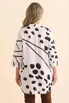 Back view of women's white and olive geometric print tunic showing longline length and relaxed fit