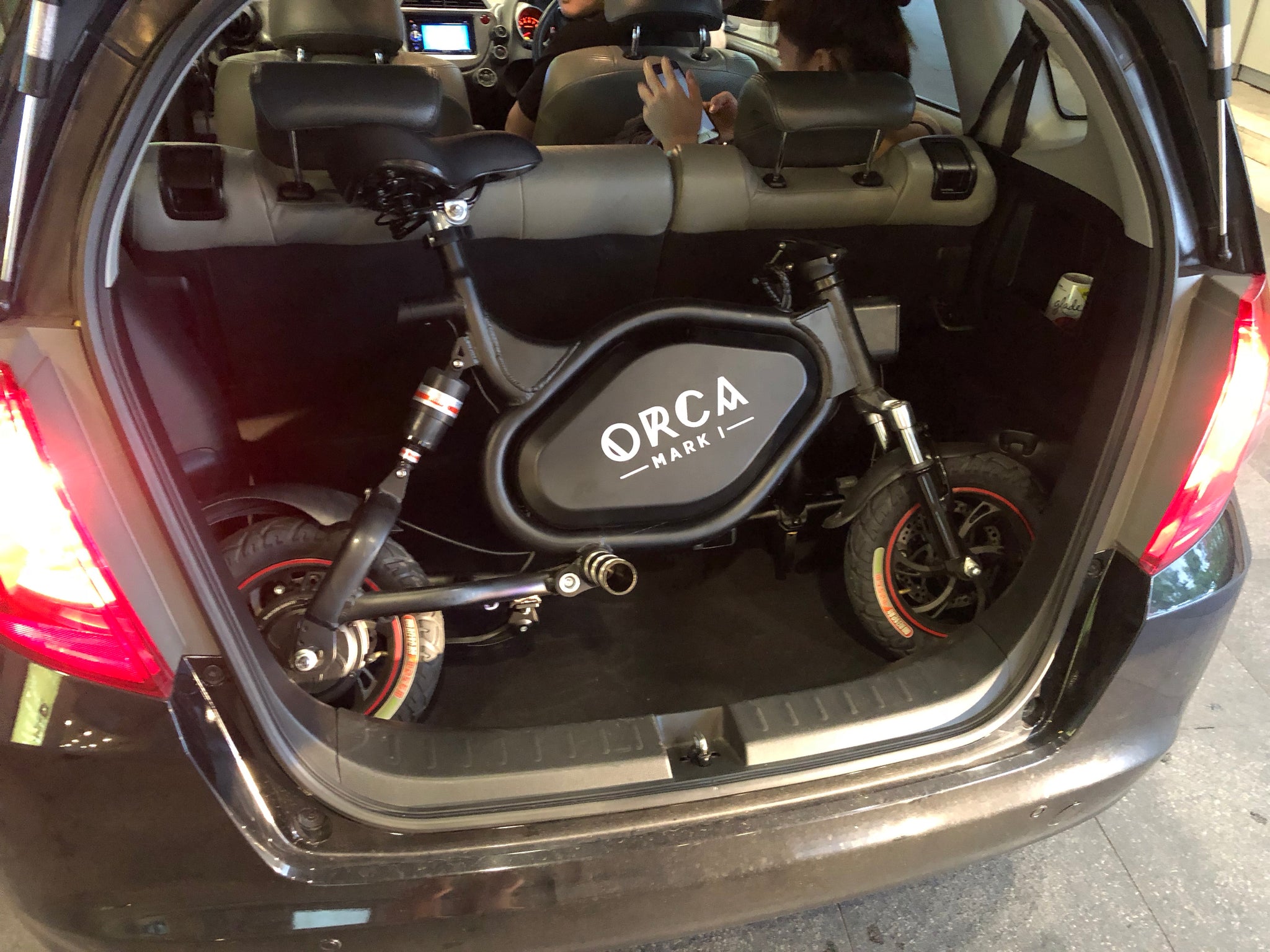 orca mark i electric scooter at the back of your trunk or car boot
