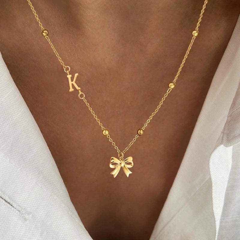 Minimalist Classic Style Letter Bow Knot 201 Stainless Steel 304 Stainless Steel Pendant Necklace
