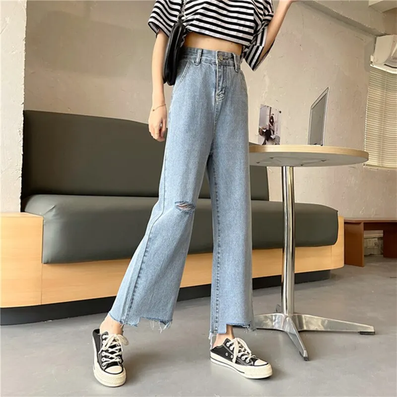 Ripped High Waist jeans for Women in wide leg denim clothing. Quality fashion at vintage