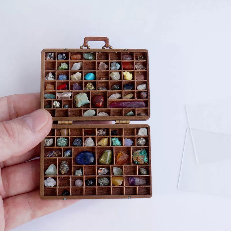 COLLECTION OF STONES IN A SUITCASE
