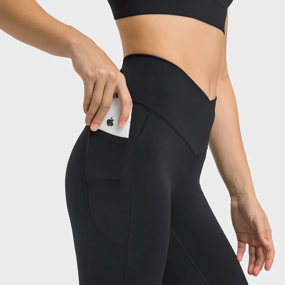 Shop no front seam high waist criss cross capri leggings with side pockets online on Hergymclothing Black