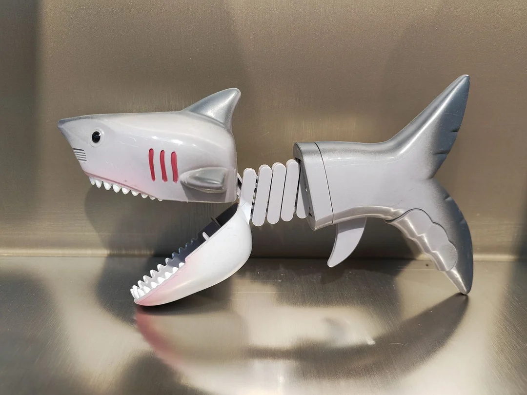 Creative toy with a biting shark
