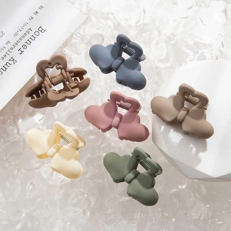 Women’s Sweet Geometric Bow Knot Plastic Resin Stoving Varnish Hair Claws