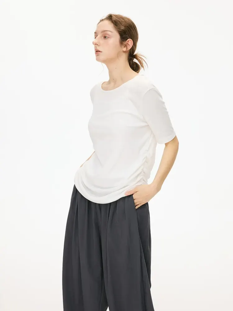 Simple white short-sleeved top with side pleats