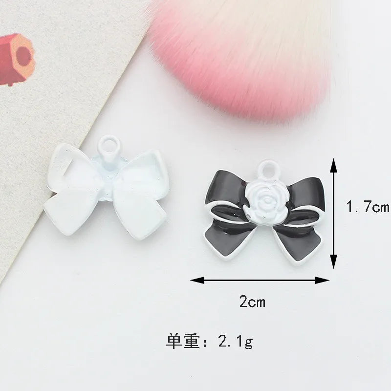 10 PCS/Package 1.5 * 20mm 14 * 14mm 7 * 12mm Alloy Rhinestones Pearl Number Heart Shape Bow Knot Polished Pendant