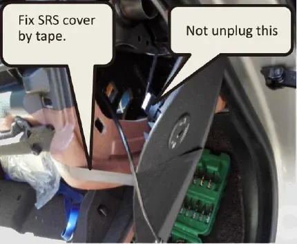 USB cable routed behind the right-hand SRS cover in a BMW F10