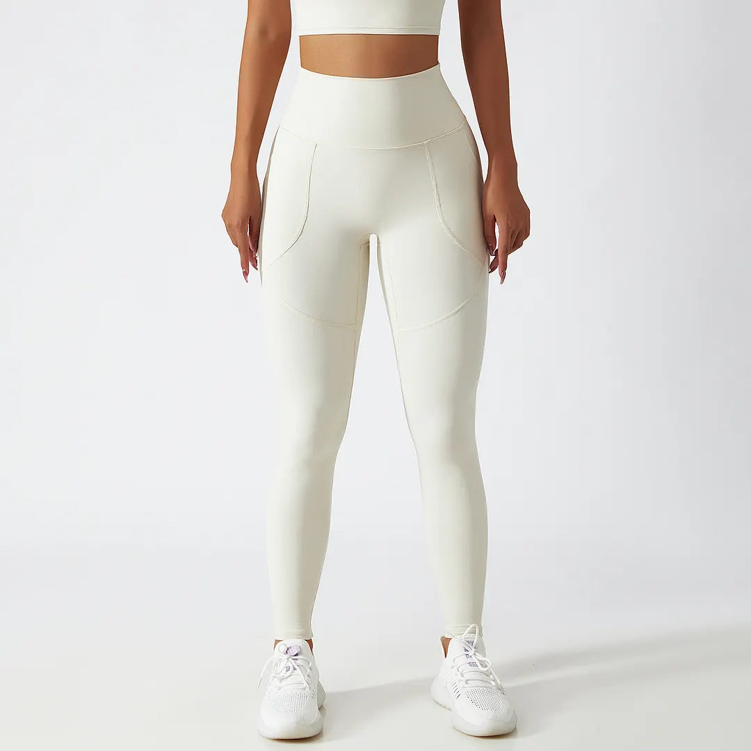 Buy Hergymclothing Cream Apricot renewable fabric sustainable no front seam yoga leggings with side pockets online