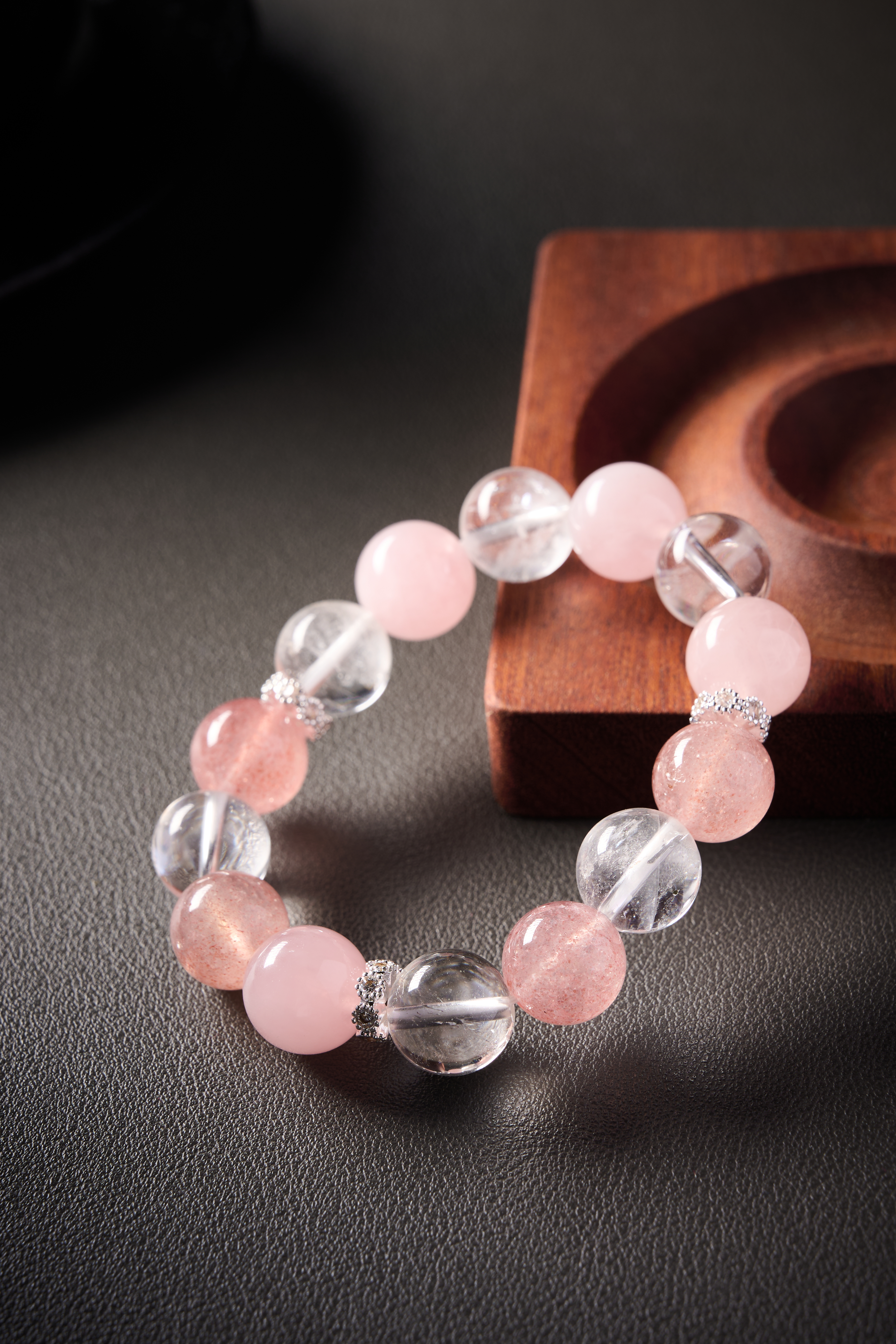 Texture highlight – contrast of clear quartz transparency and strawberry quartz pink sparkle.