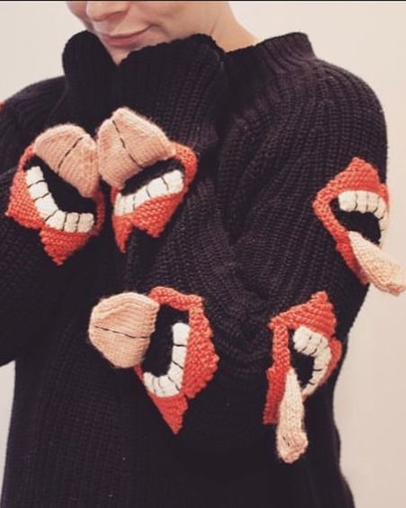 Stick out your tongue to decorate a knitted sweater