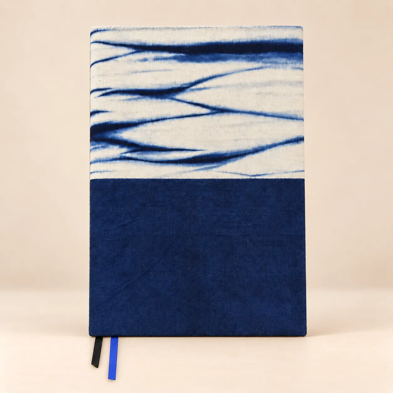 Indigo Flow notebook with a blue-and-white tie-dye cover and two ribbon bookmarks