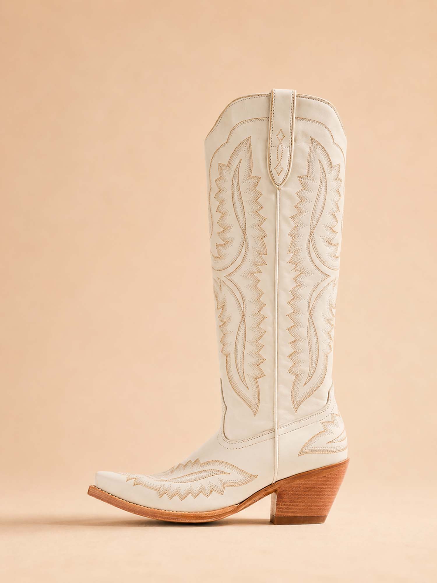 The perfect choice for a country music festival: women's denim boots for Spring/Summer 2026 featuring retro flame and geometric embroidery.