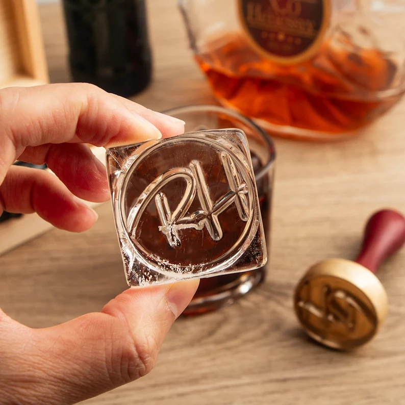 Branded clear ice cube with personalized logo in a professional whiskey cocktail, the perfect unique Father's Day or Groomsmen gift.