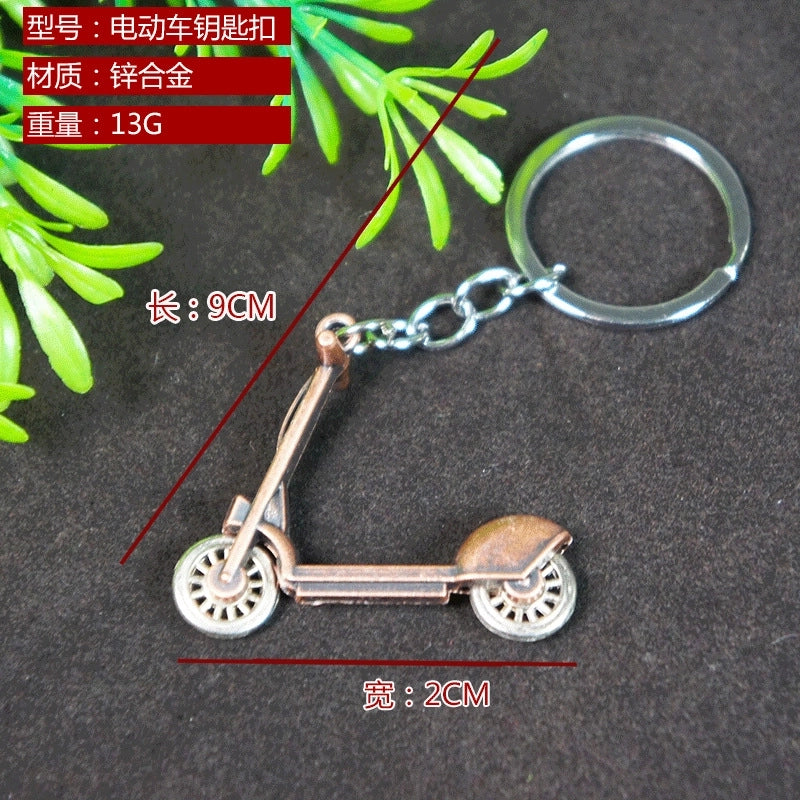 Factory Sales Metal Simulation Shell Pistol Tank Aircraft Hammer Bell Ear Spoon Keychain Uncle Souvenir
