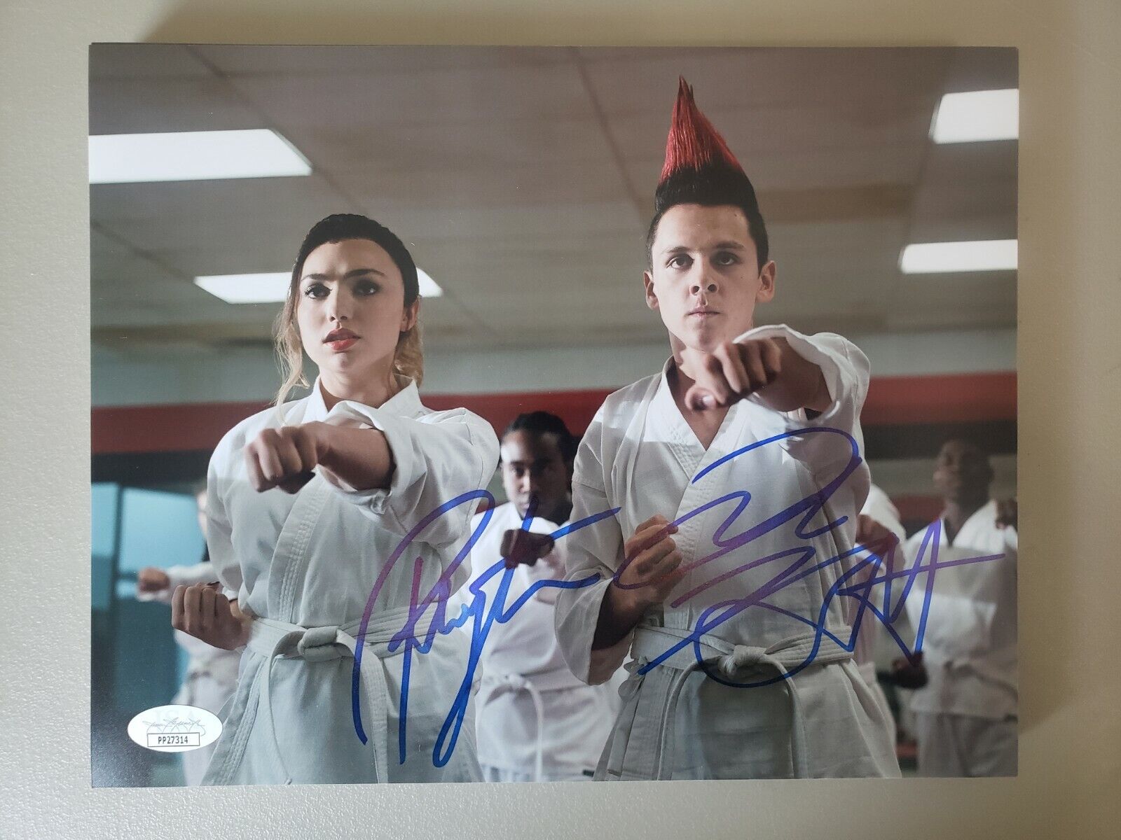 8X10 Autographed by Jacob Bertrand and Peyton List in Cobra Kai Season 3. JSA