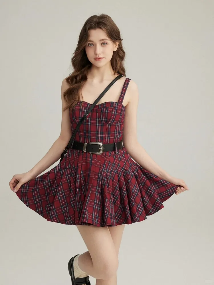 Red and black plaid camisole mini dress with a black waist belt.