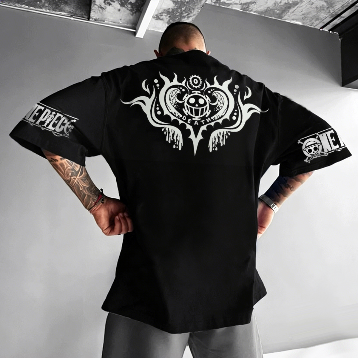 Black Oversized Graphic T-Shirt with Bold Back Print and Sleeve Logos