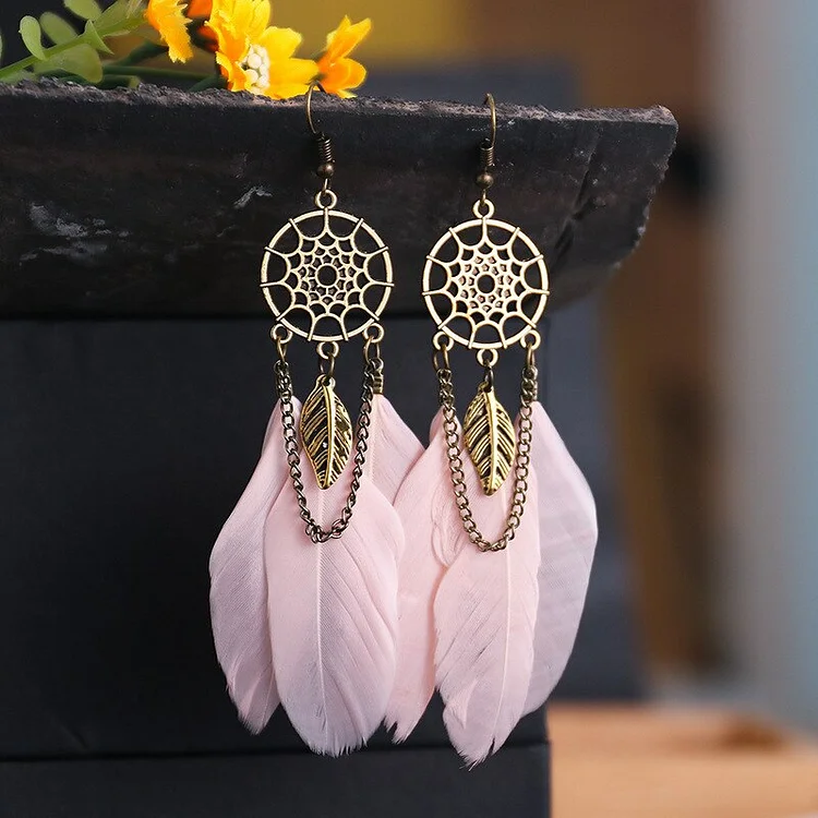 Premium Photo | Earrings of dream catcher with feathers threads and beads  rope hanging dreamcatcher handmade