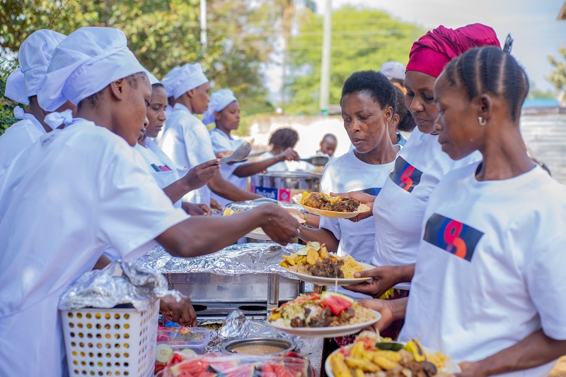 The staff area distributing food at the food party.