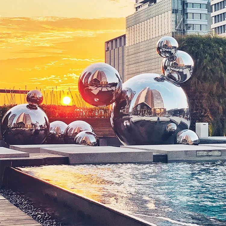 Mirror-polished stainless steel sphere outdoor public art installation