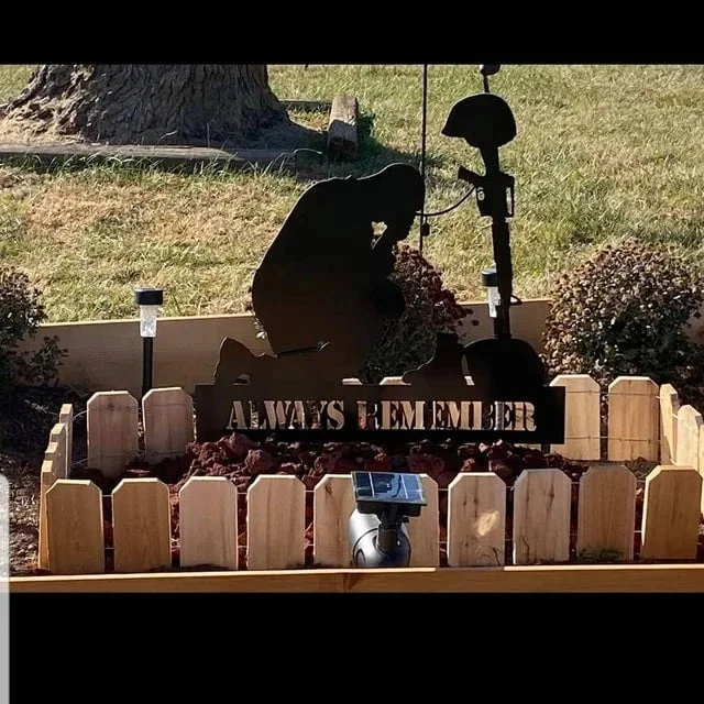 Memorial metal plaque for fallen soldiers, yard