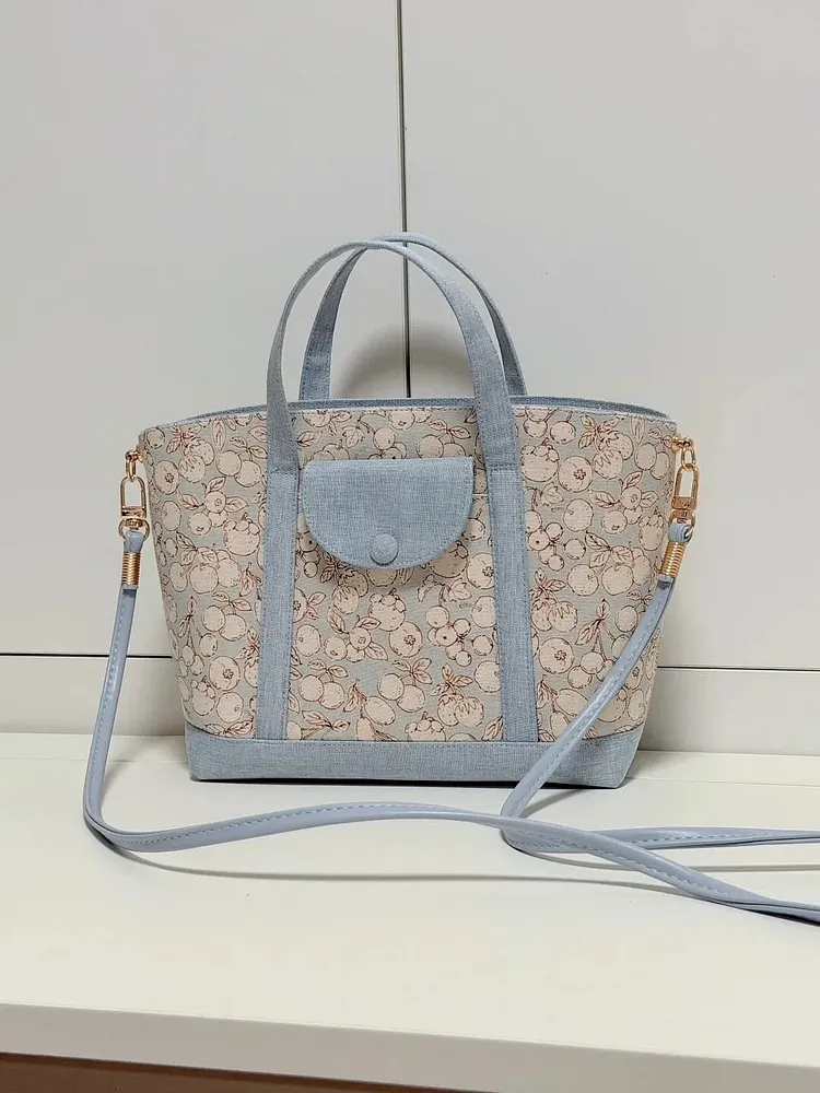 Light blue canvas tote/crossbody bag with floral pattern