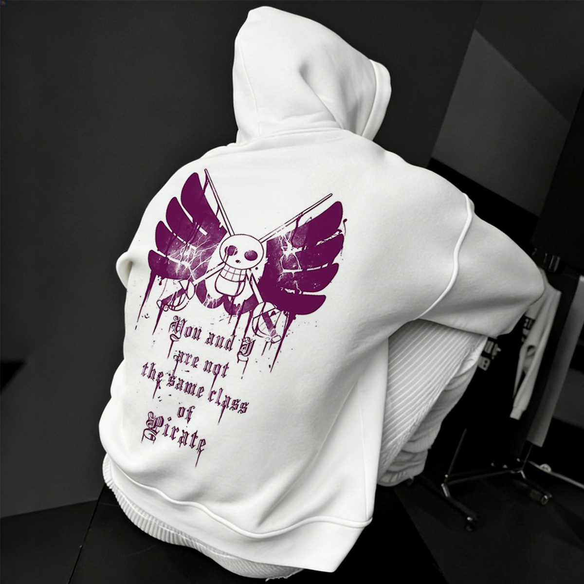 White Hoodie with Pirate Skull Wings Graphic and Bold Quote Design