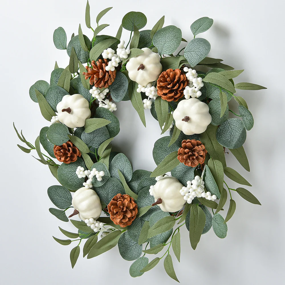 White pumpkin wreath decoration with eucalyptus leaves