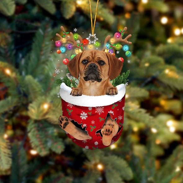 Puggle In Snow Pocket Christmas Ornament.