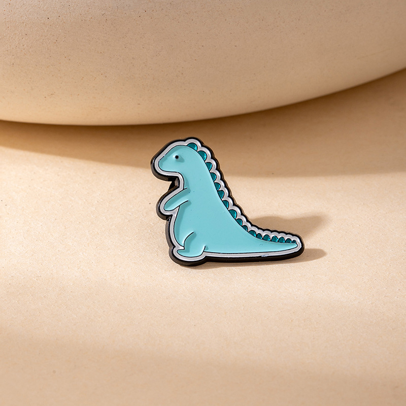 Hot-selling cute cartoon dinosaur badges protect the earth brooches creative and adorable clothing accessories
