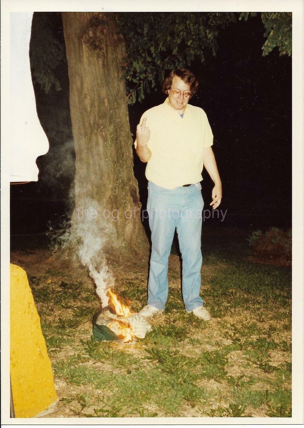 5x7 FOUND Photo Poster painting OF A MAN GIVING THE FINGER TO A SMALL FIRE Flipping Bird 911 10