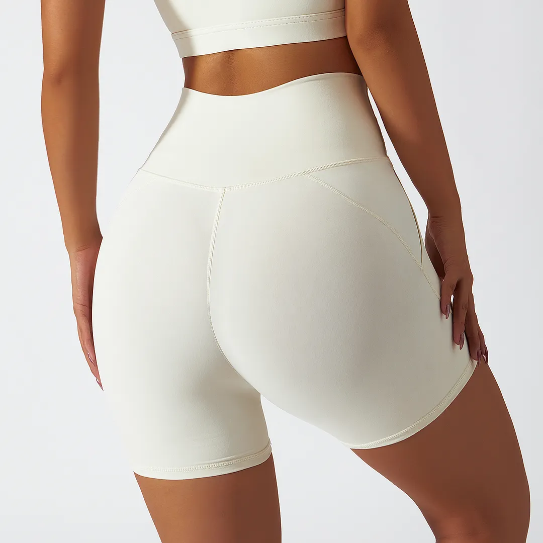 Buy Hergymclothing Cream Apricot renewable fabric sustainable no front seam yoga shorts with side pockets at an affordable price