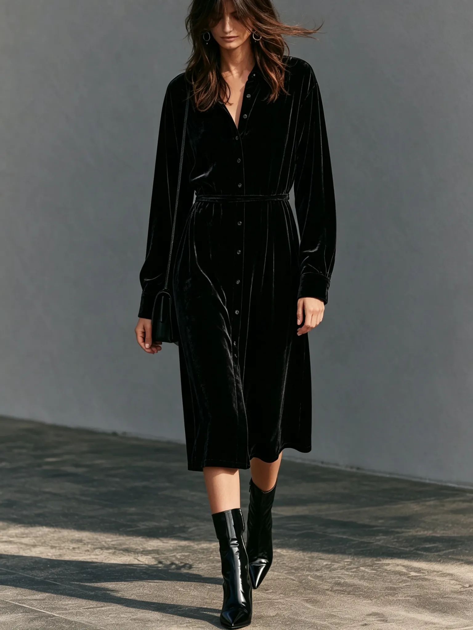 Model wearing a black velvet dress