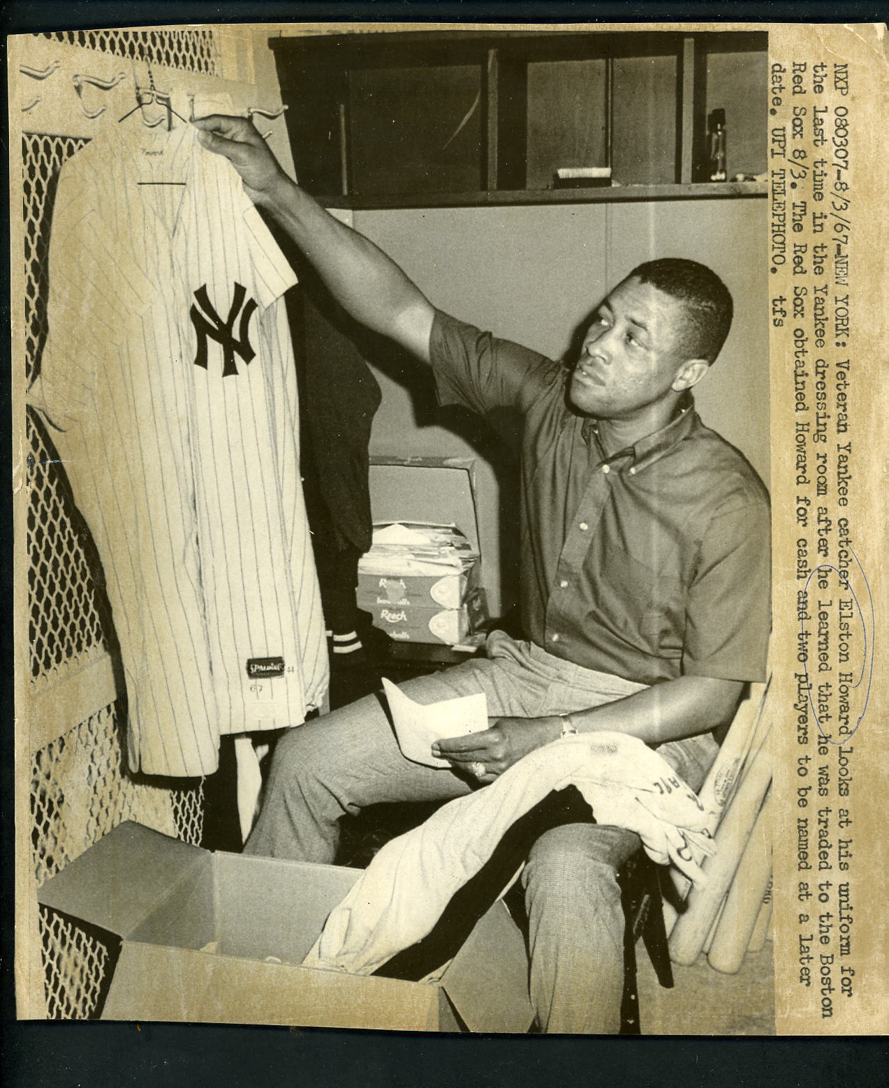 Elston Howard hangs up Yankees uniform Traded to Red Sox 1967 Press Photo Poster painting