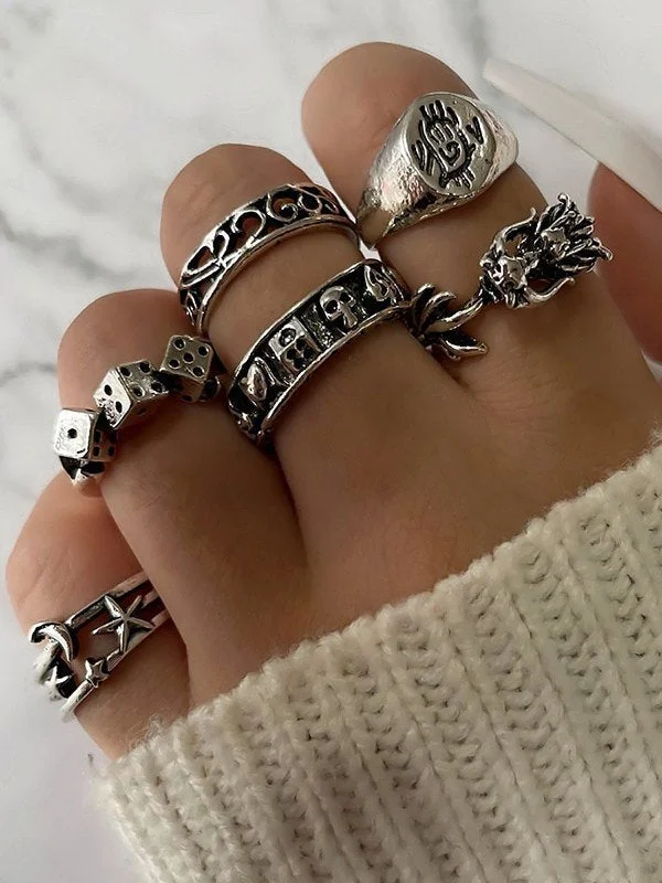 Brownm of 6 silver punk skull rings