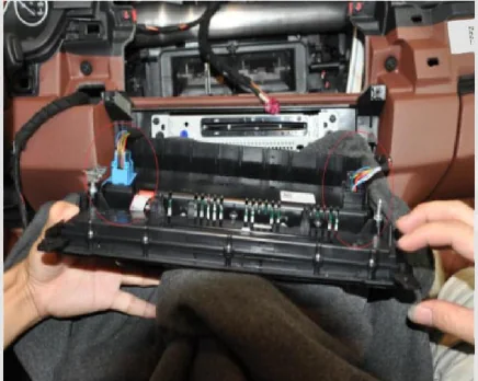 BMW F10 CD and climate-control panel pulled forward before unplugging