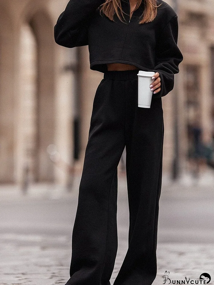 Sleek Black Zippered Collared Top and Wide Leg Pants Ensemble