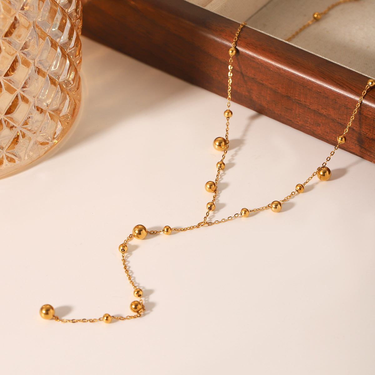 Ins Style Stainless Steel Y-Shaped Chain Necklace Design Round Bead Chain Small Gold Ball Pendant Necklace Titanium Steel Sweater Chain