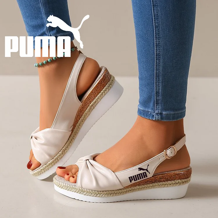 Sandały na koturnie Puma z kokardą
