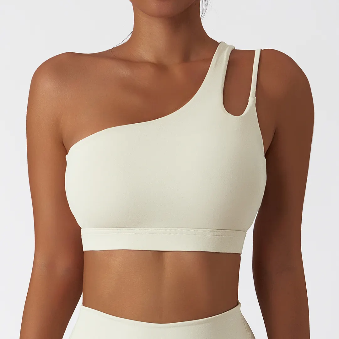 Buy Cream Apricot oblique single shoulder anti slip open back running gym fitness sports bra of high quality on Hergymclothing