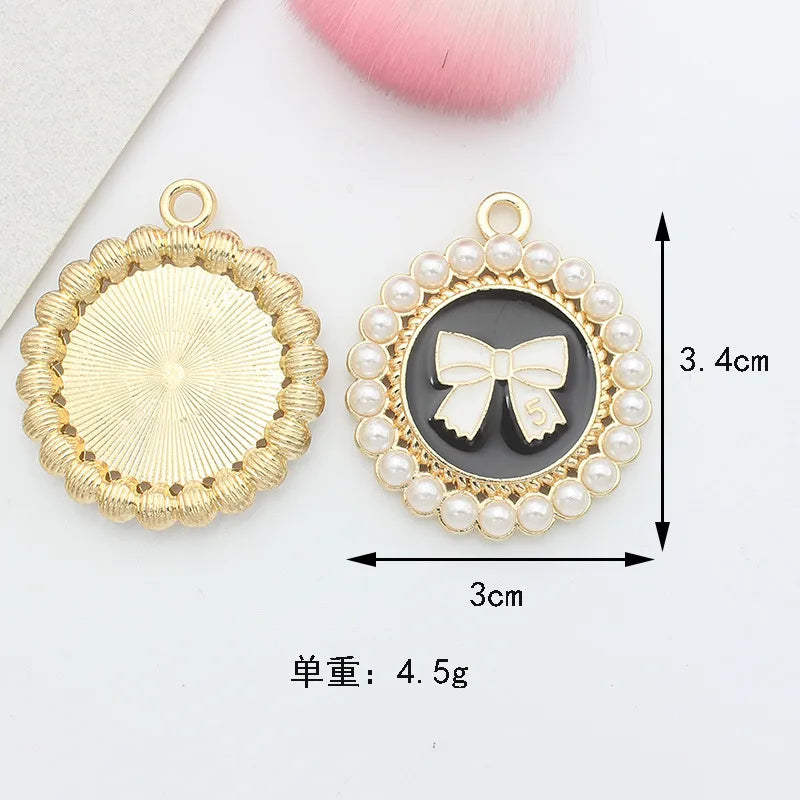 10 PCS/Package 1.5 * 20mm 14 * 14mm 7 * 12mm Alloy Rhinestones Pearl Number Heart Shape Bow Knot Polished Pendant