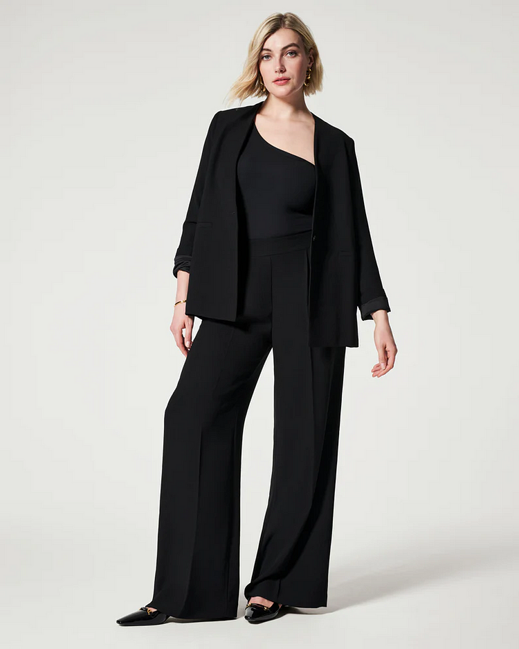 Pantaloni con pieghe in crêpe