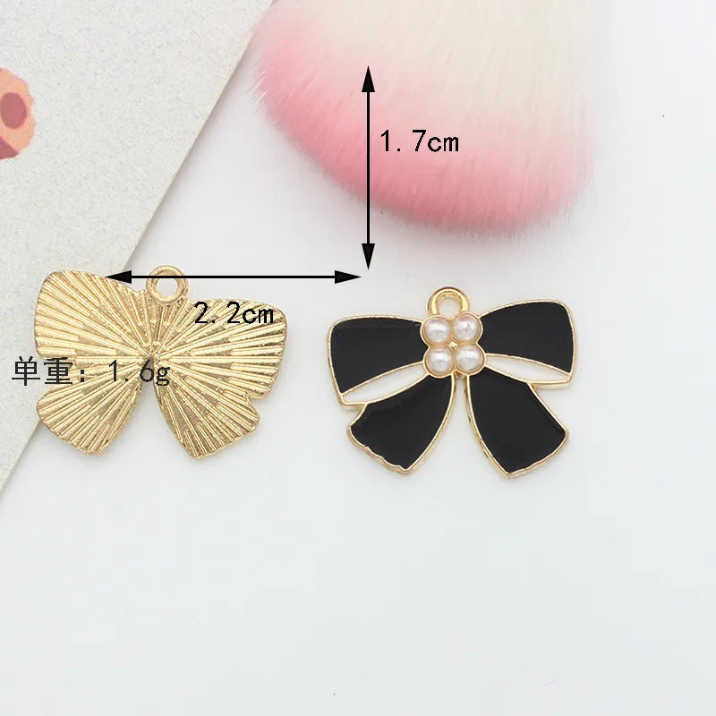 10 PCS/Package 1.5 * 20mm 14 * 14mm 7 * 12mm Alloy Rhinestones Pearl Number Heart Shape Bow Knot Polished Pendant