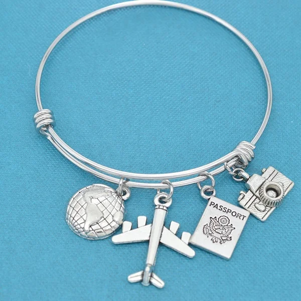 Fashion Jewelry DIY Charm Bangle, Bracelet for Women & Girls - Personalized Bracelet, World Traveler Bangle Bracelet In Stainless Steel with Earth, Airplane, Passport and Camera Charms In Silver Tones. Gift for Traveler