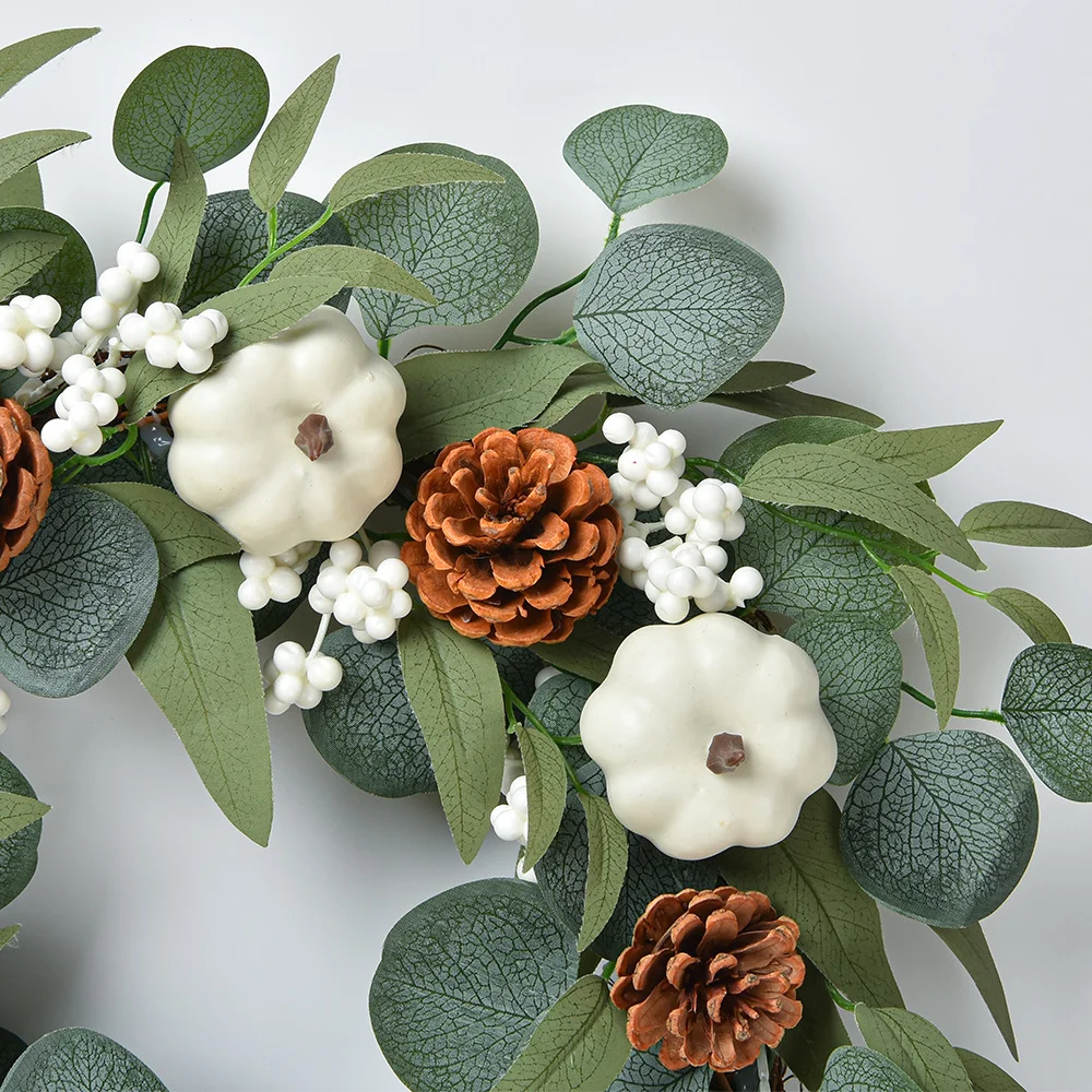 White pumpkin wreath decoration with eucalyptus leaves