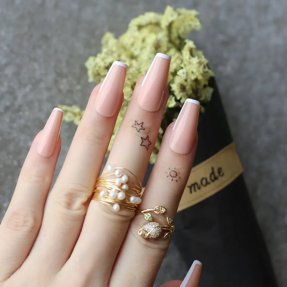 White tipped coffin nails out line UV french tips nude glossy fasle nails sophisticated nude with little bit of tipping edge-Nail Inspo