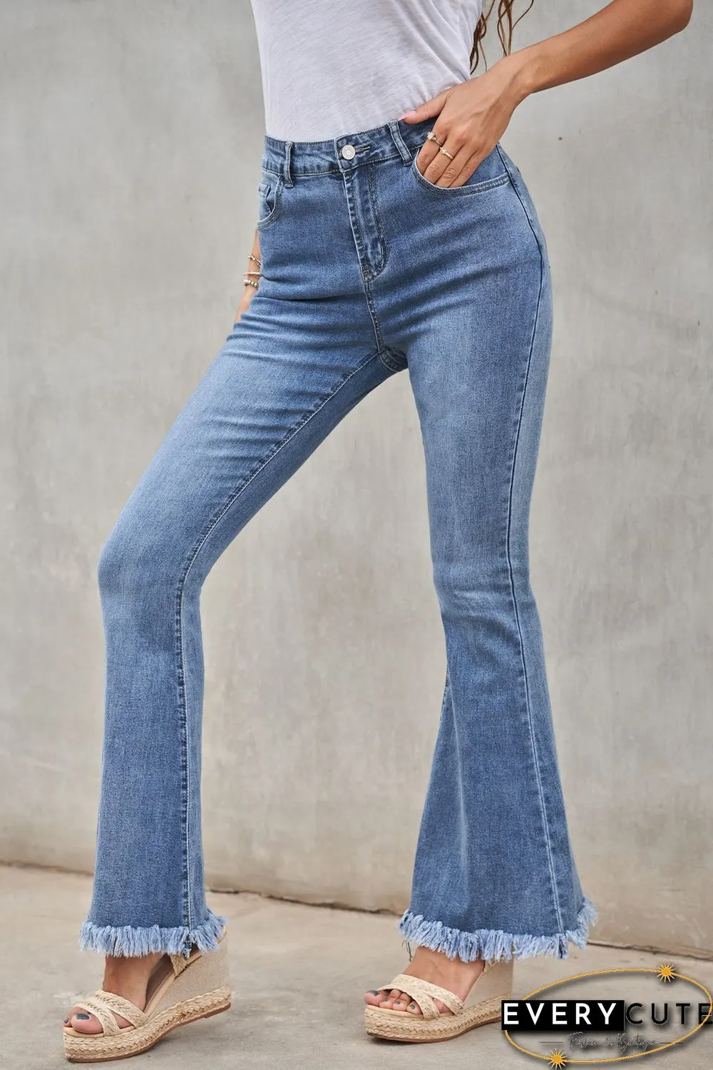 Medium Washed High Waist Flare Jeans with Raw Edges