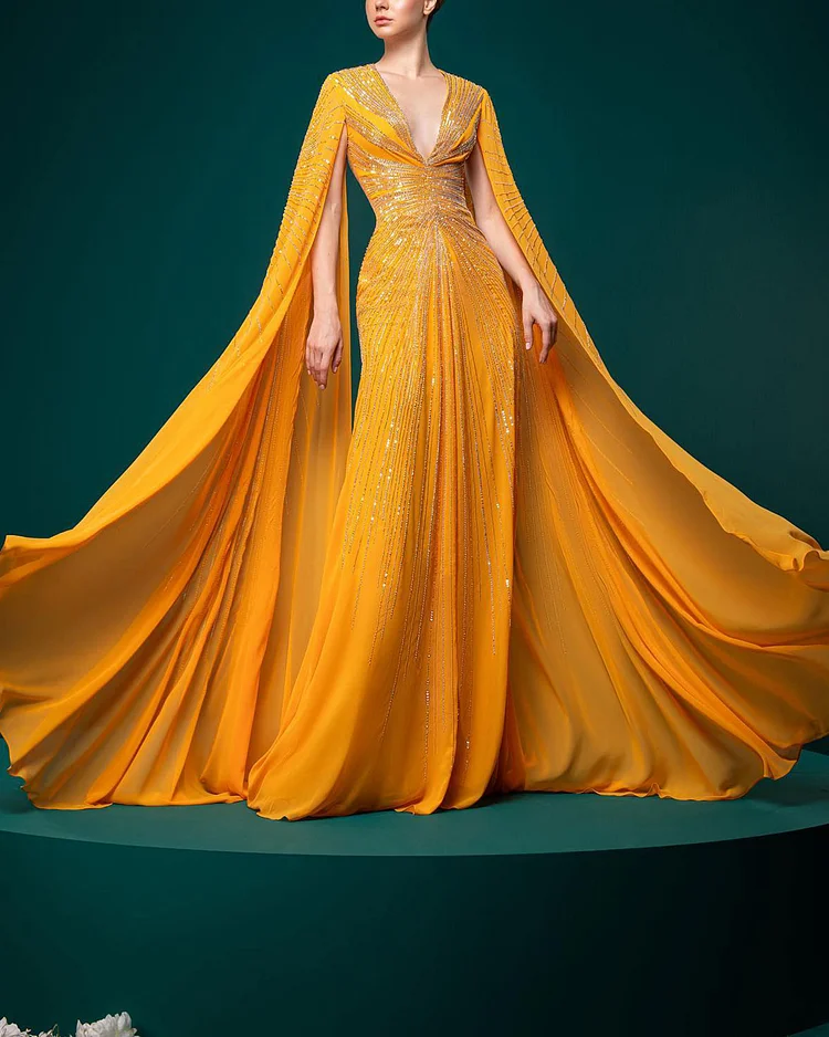 Elegant sequined cape gown
